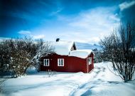 Small rural house in winter scenery